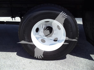 Wheel assembly with Continental tire and white rim; faint watermark overlay from dealership.