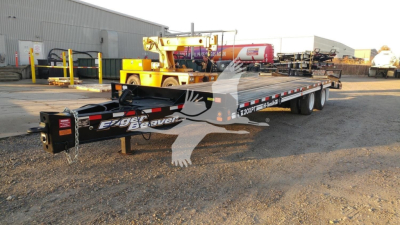 2026 Eager Beaver 20XPT trailer in outdoor lot showing Eager Beaver branding on side and low-profile gooseneck with tandem axles.
