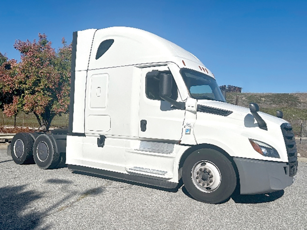Truck side view showing 2022 Freightliner Cascadia126 sleeper cab with white exterior and long hood, VIN 3AKJHHFG6NSNN0998 not visible on image but listing text shows. No engine or fluid labels visible in this image.
