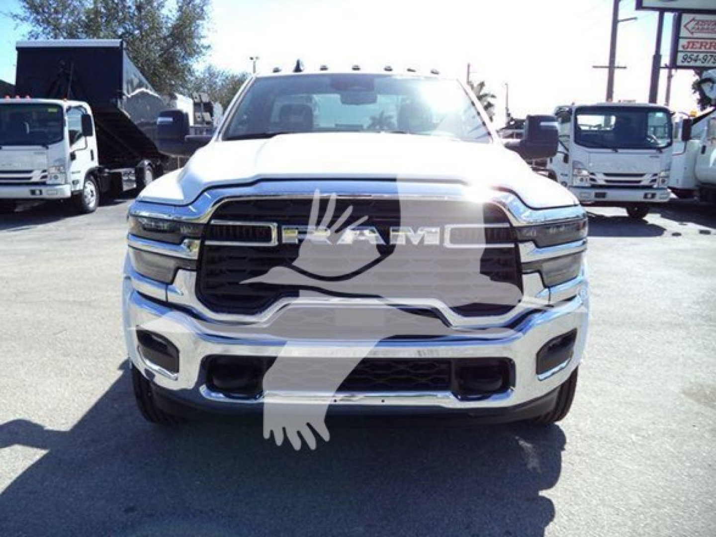 Front view of a white 2026 Ram Big Horn truck showing RAM grille and headlights