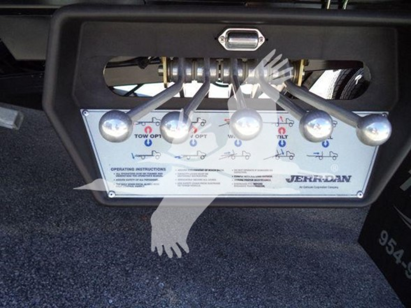 Ram truck rollback plate showing control panel with multiple levers and labels.