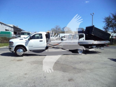 Ram 2026 Big Horn rollback truck in white with a tilt bed and dump bed visible, side view, VIN 3C7WRNDLXTG215292.