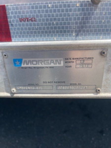 Morgan date manufactured plate on rear with DOT-C1 label, serial number and model number fields, shows manufactured month/year 2018? and VIN portion obscured.