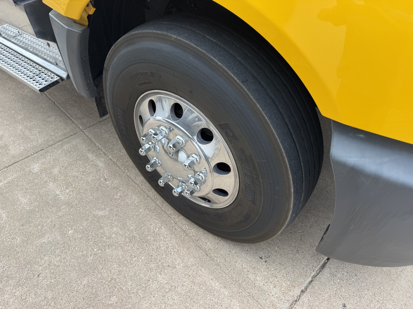 Truck wheel and tire on 2019 International LT conventional daycab showing hub and lug nuts