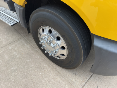 Truck wheel and tire on 2019 International LT conventional daycab showing hub and lug nuts