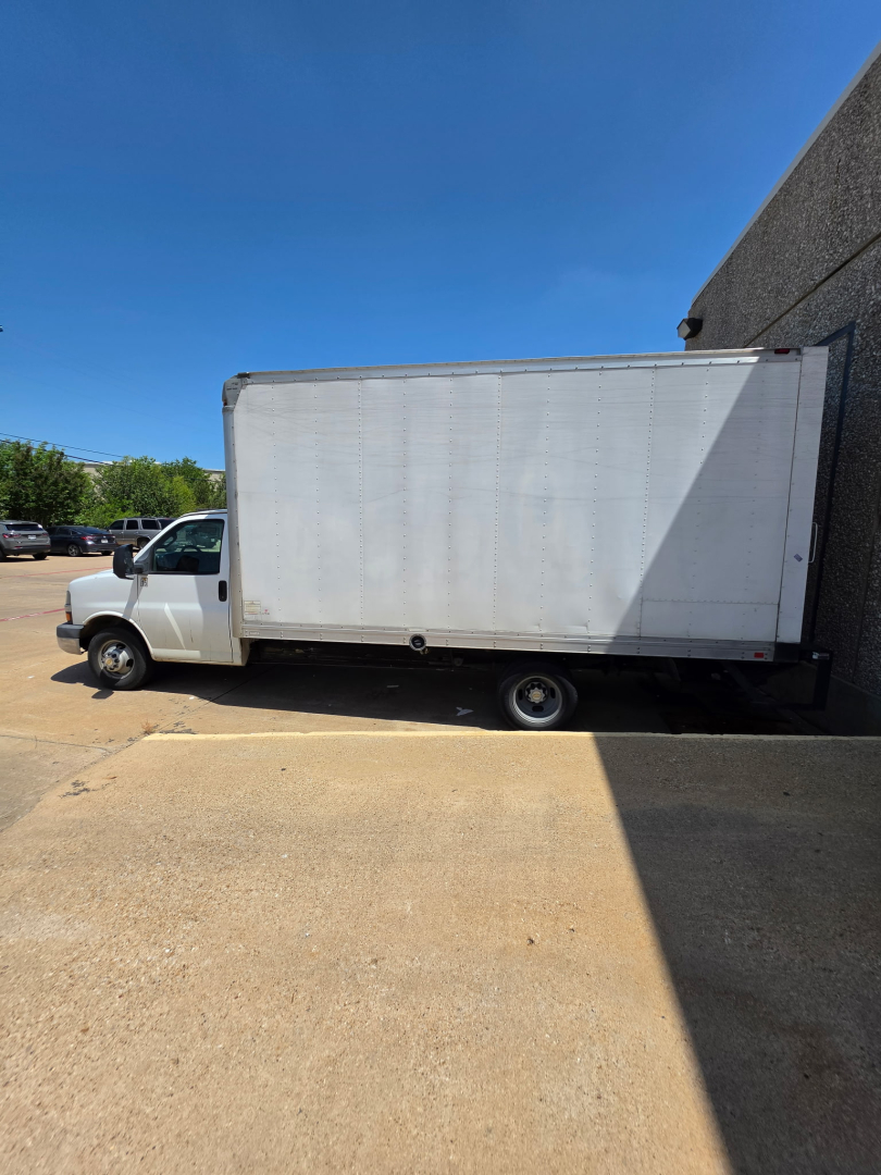 Chevrolet Express 3500 box truck side view showing cargo box and cab
