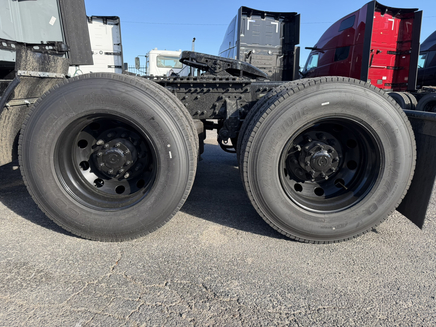 Dual rear truck wheels and chassis frame showing wheels and suspension components for a 2026 Mack PR64T76H tractor.