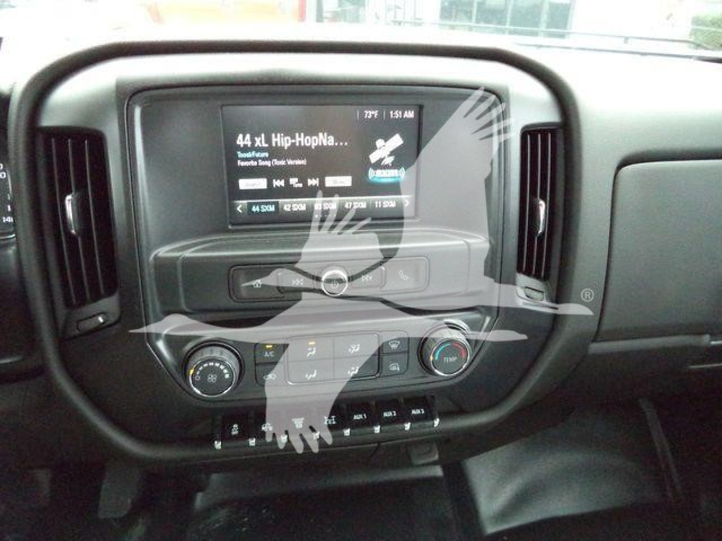 Interior of a 2023 International CV rollback truck showing the center touchscreen infotainment system and climate controls.