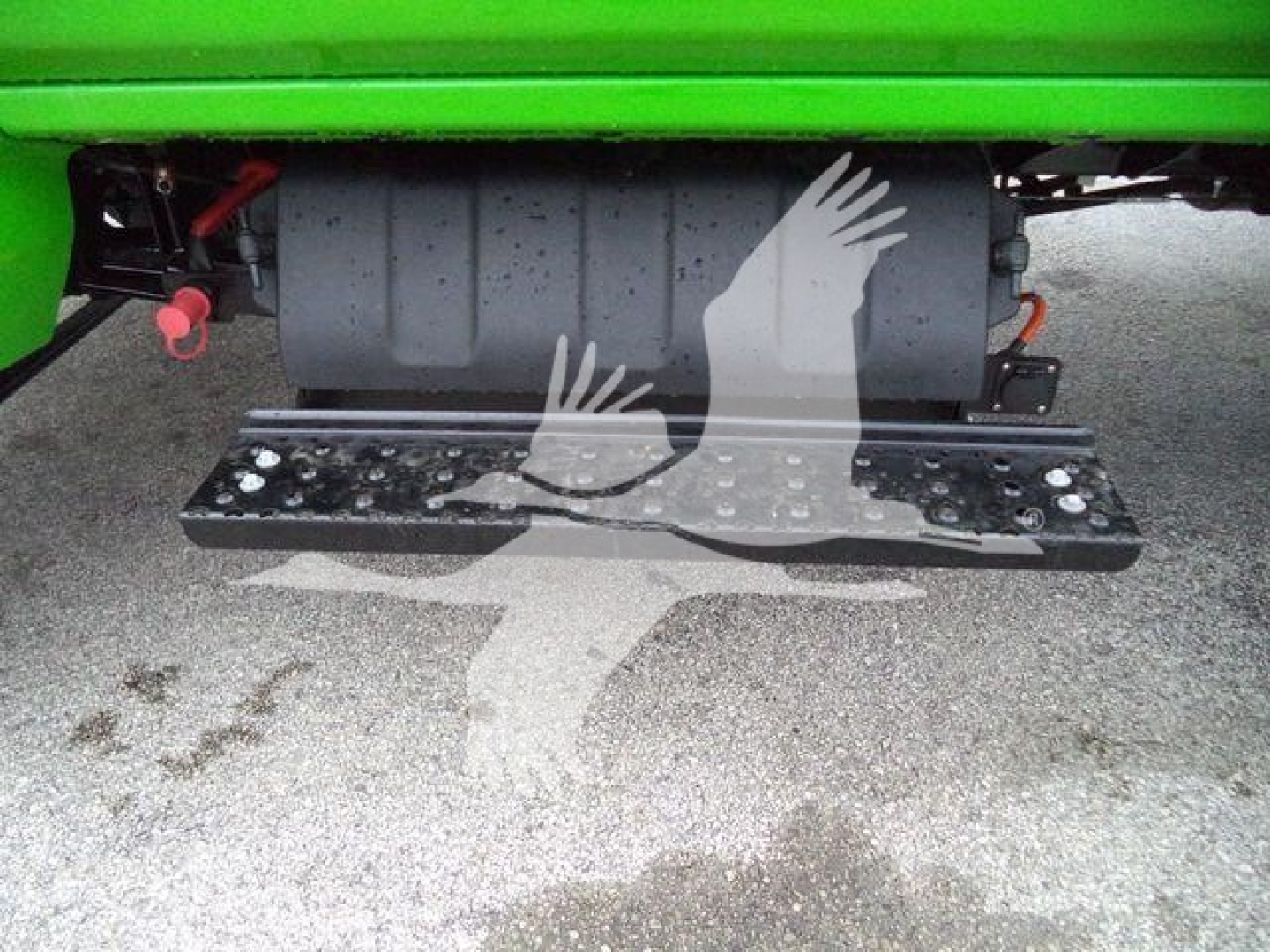 Trucks component view showing undercarriage with step/step plate and fuel tank; part of a green truck with black running board.