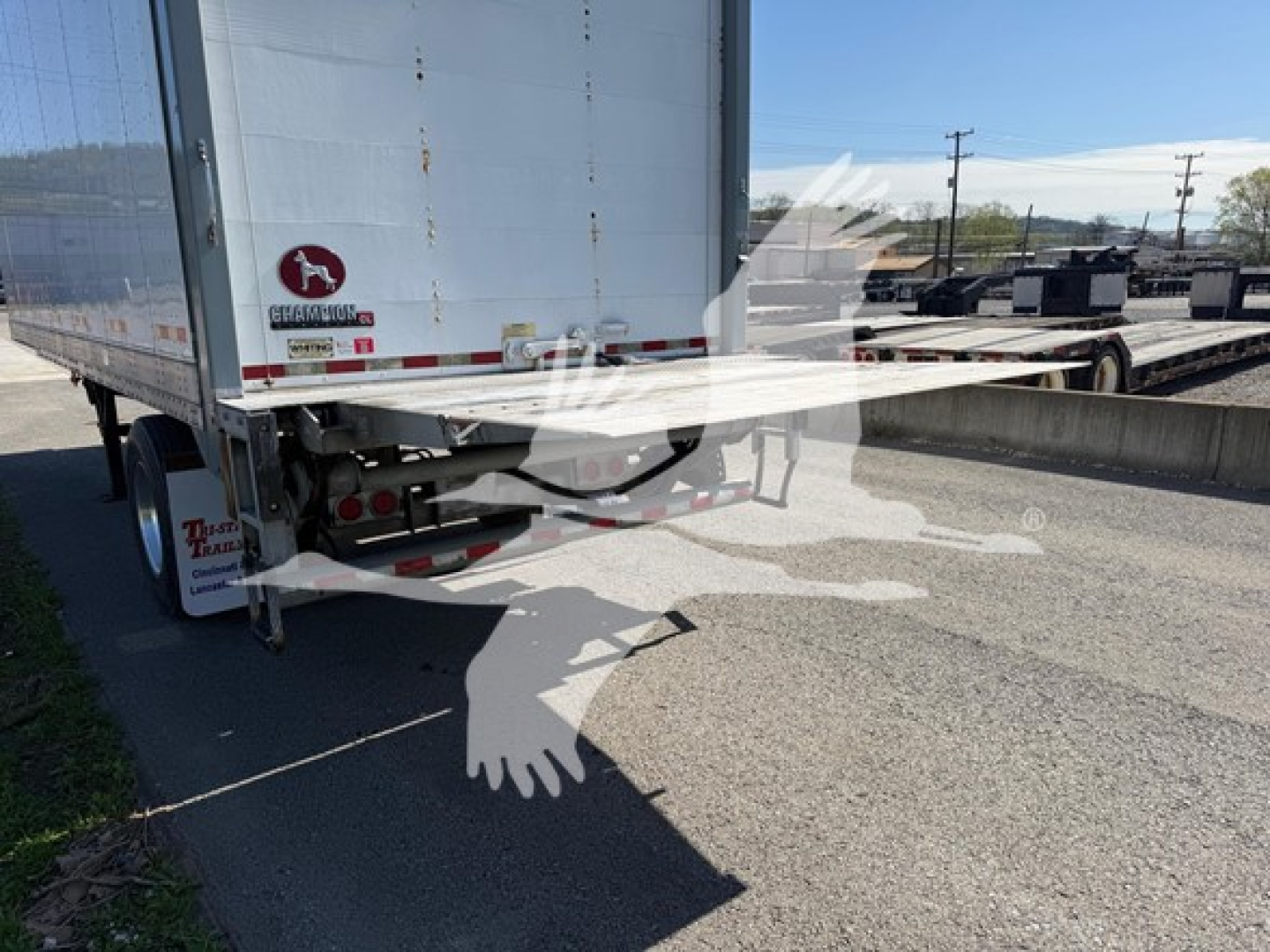 Trailer rear view showing Great Dane Pup van with ramp deployed, white corrugated trailer, stock number 7652, VIN 1GRAA5611JB702094 visible.