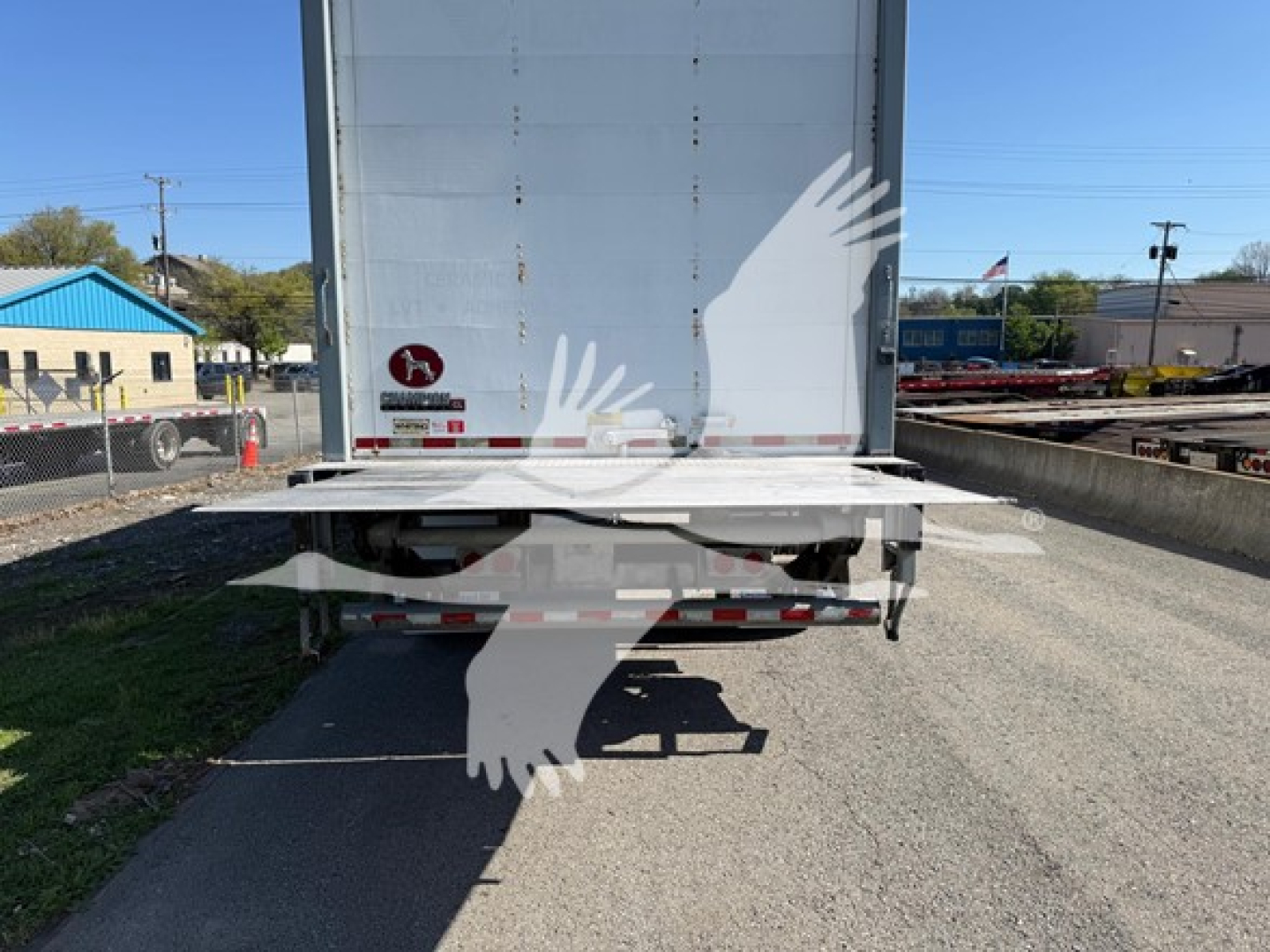 Great Dane Pup Van trailer rear view showing closed ramp, taillights, and wheel assembly with stock number 7652 and VIN 1GRAA5611JB702094 visible from the yard.