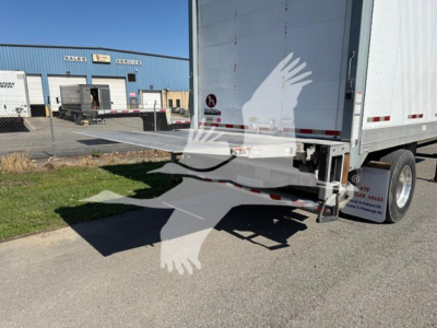 Trailer hitch area of a Great Dane Pup van trailer showing rear bumper and side ramp with hitch; stock number 7652 and VIN visible in listing context.