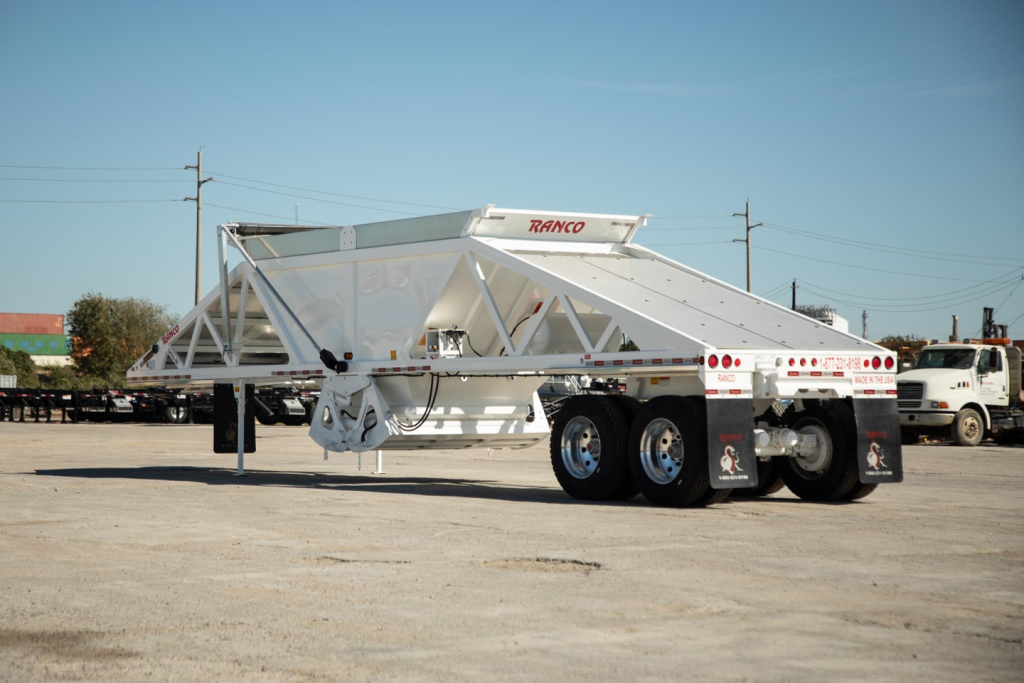 Ranco wet sand switchgate bottom dump trailer in white with dual rear axles and long body