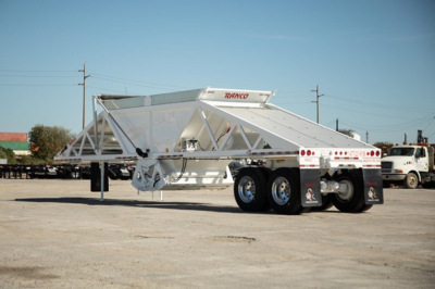 Ranco Wet Sand Switchgate Bottom Dump trailer showing white painted steel frame and rear dual axle configuration.