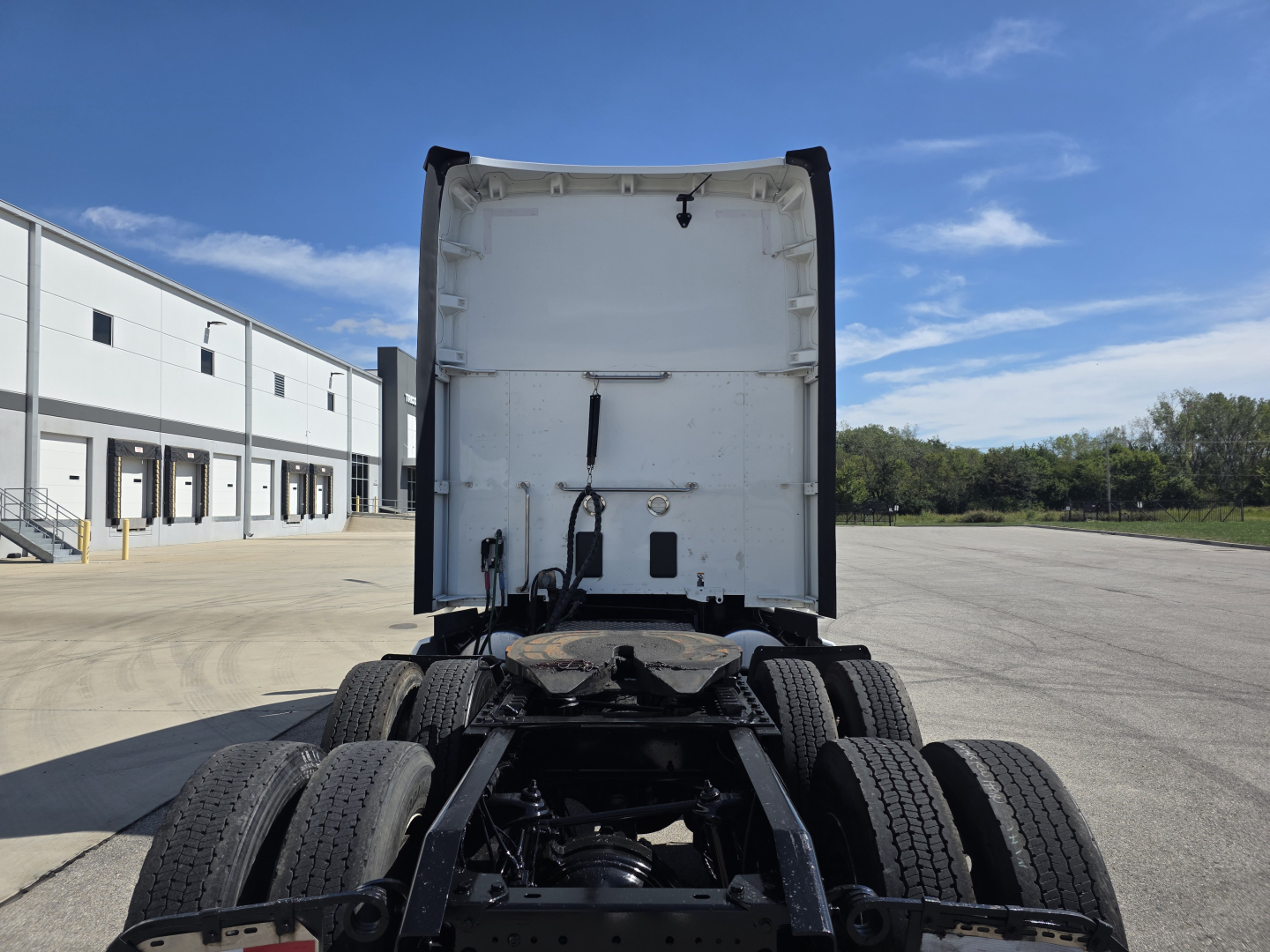 Kenworth T680 rear view showing chassis and dual rear axles with tires