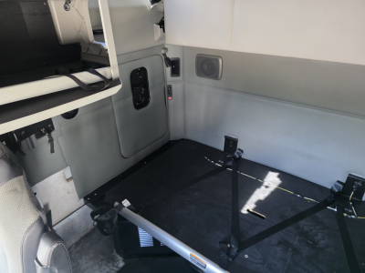 Kenworth T680 interior cargo area with seating area and cargo straps visible, 2022 model, VIN 1XKYD49X9NJ485551, stock 0632032.