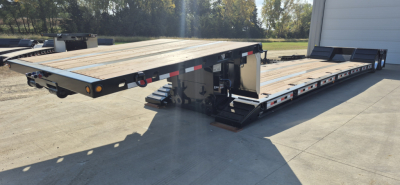 Flatbed trailer with drop-down dual deck and slide-outs showing wooden deck, rearLights, and hydraulic landing gear — Alpha Mech detach double-drop trailer