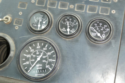 Dashboard gauges of a used Ottawa truck showing speedometer, fuel, oil pressure, water temperature, and other indicators.