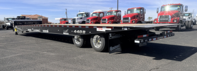 40-ton traveling axle lowboy trailer showing Landoll 440B-53 markings and dual rear axles.