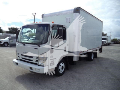 Isuzu NPR-HD box truck from a side-front view showing box cargo area and cab, stock number T06129FM listed as used.