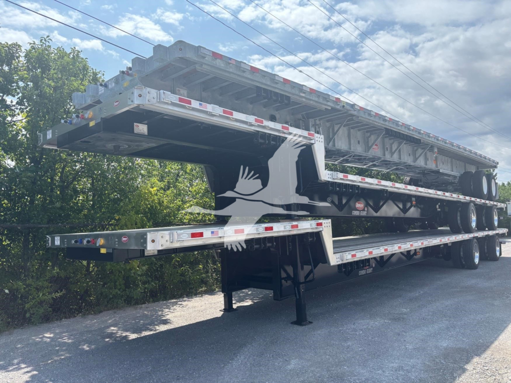 Trailer with multiple stacked drop deck sections for a Dorsey combo drop, showing new trailers in a yard.