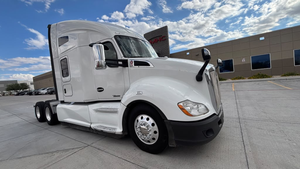 Kenworth T680 tractor from front-left side showing sleeper cab, chrome mirrors, and dual rear axles; no text visible on components.