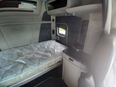 Peterbilt 579 truck sleeper interior with bed and cabinetry visible