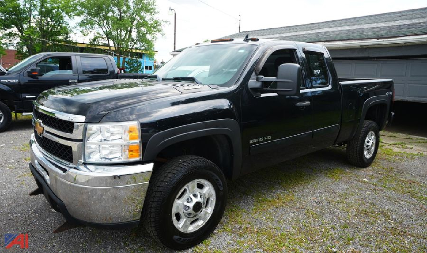 Chevrolet Silverado 2500HD Ext Cab pickup truck in black, view of front-left side.