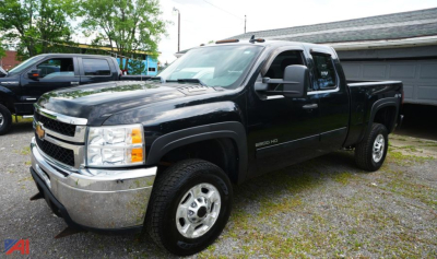 Chevrolet Silverado 2500HD Ext Cab pickup truck in black, view of front-left side.