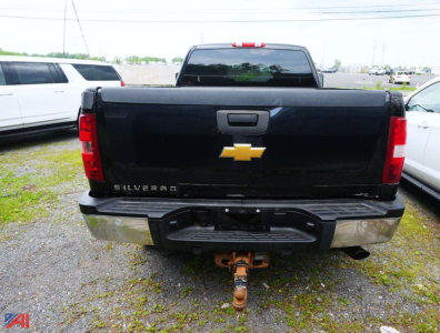 Chevrolet Silverado rear view showing Silverado emblem and towing hitch.