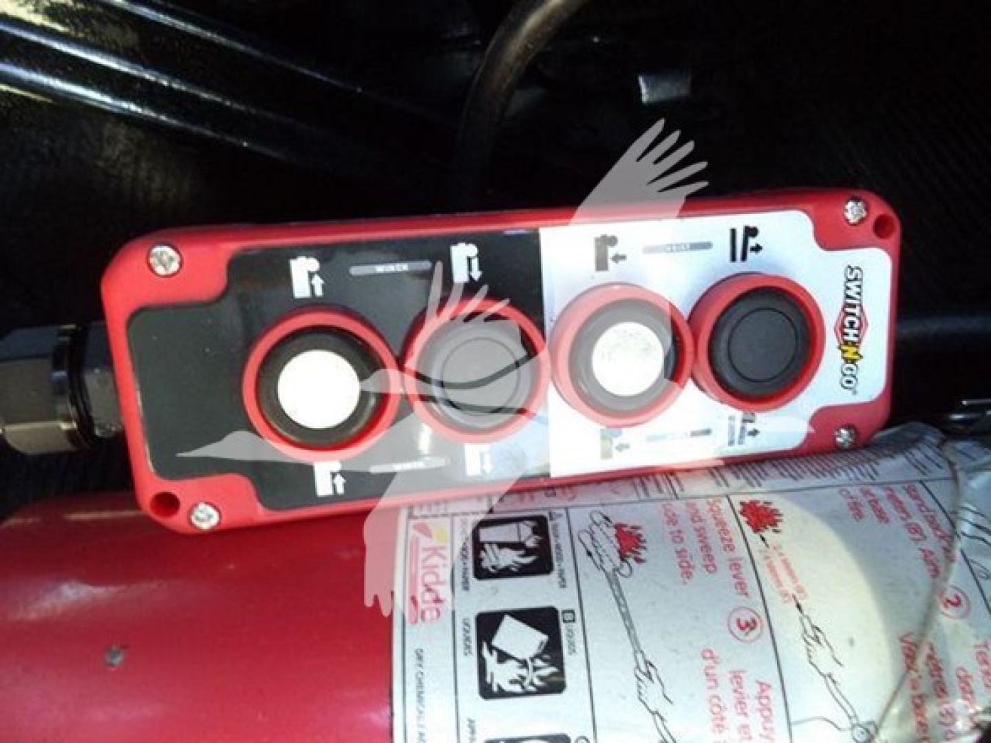 Panel showing control switches with labels 1ft 2ft 3ft and various icons, mounted on red housing; visible branding says SWABR? not clear.