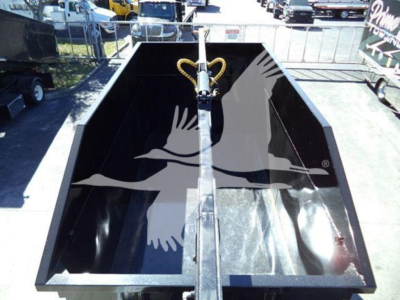 Peterbilt 337 roll-off truck bed showing interior with lift chain and hydraulic mechanism.