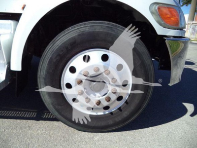 Peterbilt 337 wheel and front fender side view showing front dual tires and hub with lug nuts.