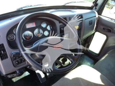 Peterbilt 337 dashboard and steering wheel interior with gauges visible; includes Robert Peterbilt logo on steering wheel