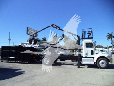 Peterbilt 337 roll-off truck with crane arm extended, white cab, black container, VIN 2NP2HM6X6LM718973 visible on listing.