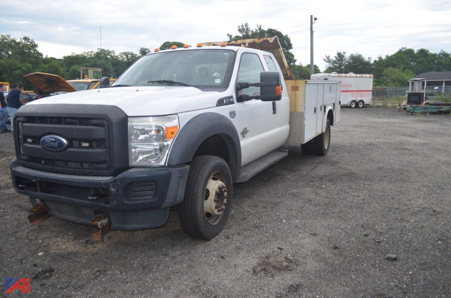 Ford F-550 Super Duty utility truck front-left view showing service body and dual rear wheels.