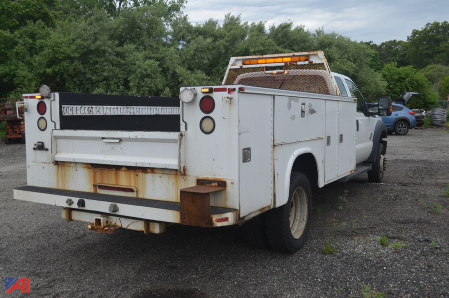 Ford F-550 Super Duty utility truck rear view with utility bed and service compartments.