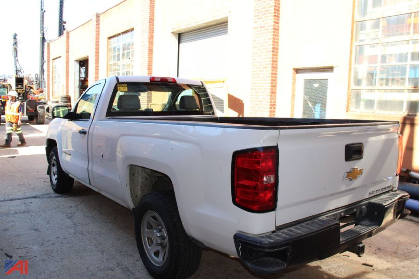 2016 Chevrolet Silverado 1500 pickup truck rear three-quarter view showing bed, taillights, and Chevrolet bowtie badge.