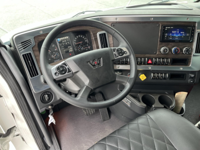 Interior of new Western Star 47X cab showing steering wheel, dashboard, gauges, touchscreen display, and center console.