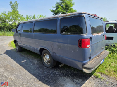 1997 Dodge Ram Van cargo van rear and side views showing blue body and windows.