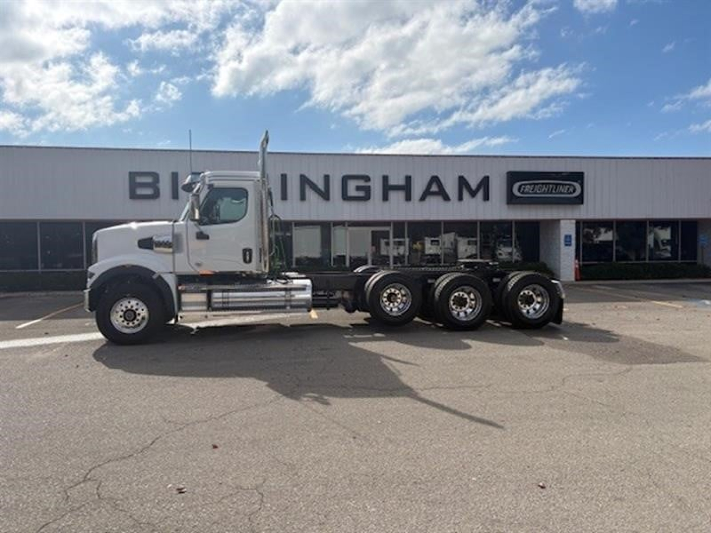 2026 Western Star 49X day cab truck side view showing front cab and dual rear axles.