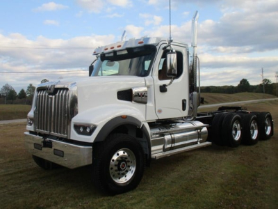 Western Star 49X Day Cab truck from a front-side view showing chrome grille and dual rear axles.