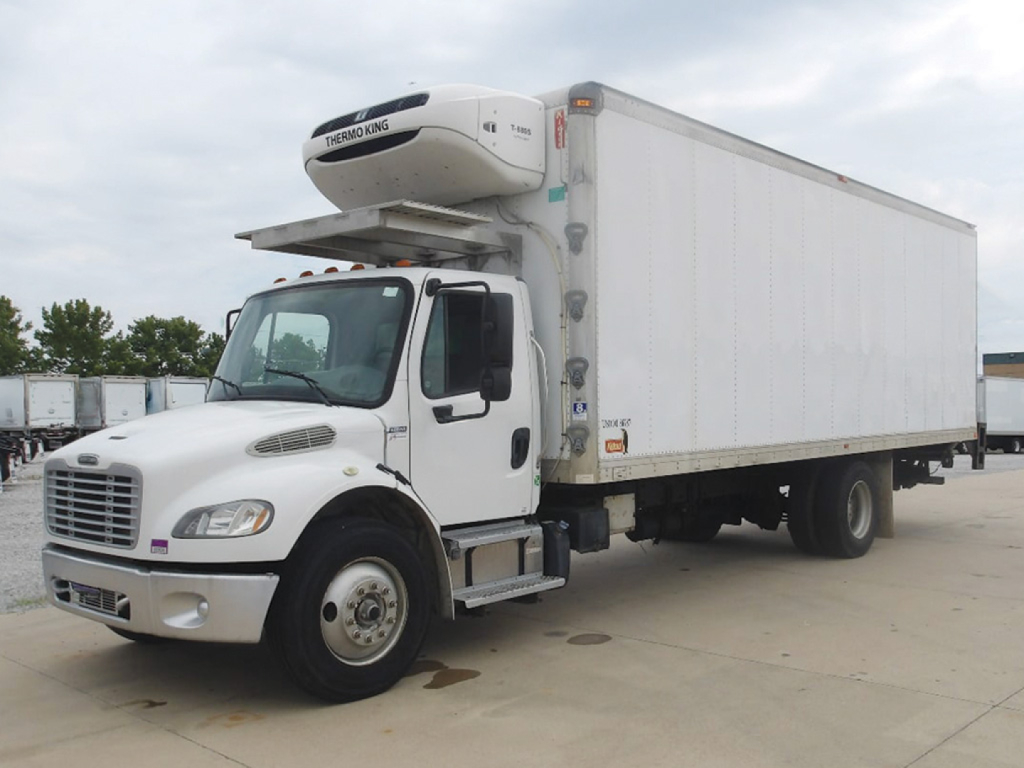 Freightliner M2 106 refrigerated box truck with a front-mounted Genoa/Denso box cryogenic cooler on the cab; white cab and box, stock number visible on the side.