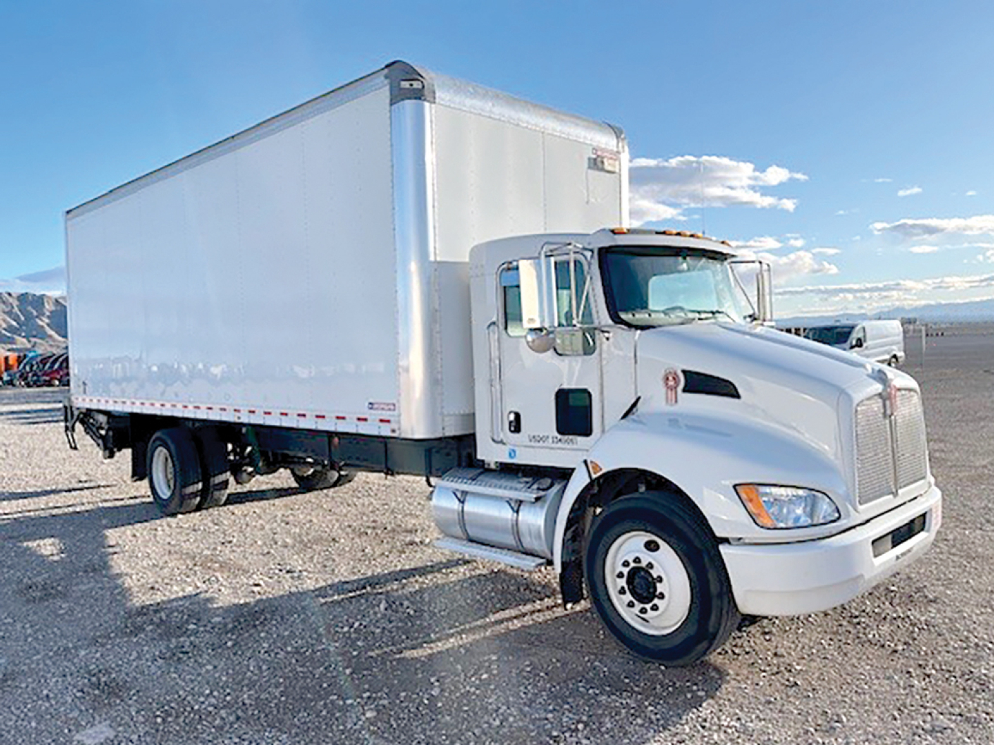 Kenworth T270 conventional daycab truck with a large white box trailer, side view, VIN NM490247 visible for listing.