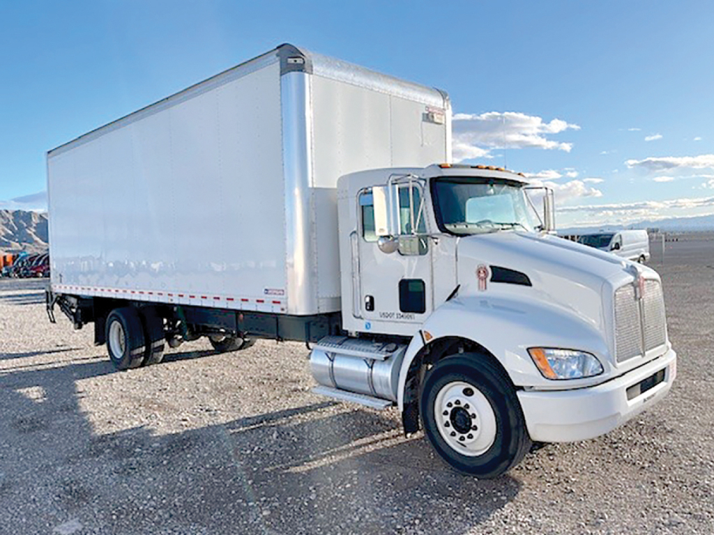 Kenworth T270 conventional daycab truck with a large white box trailer, side view, VIN NM490247 visible for listing.