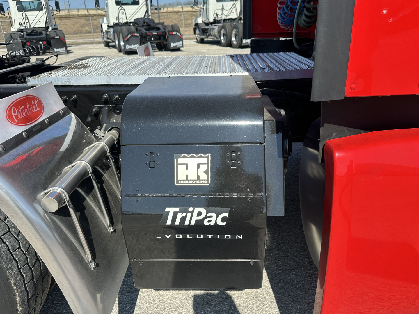Peterbilt 579 quad-dock area showing TriPac Evolution battery box with branding.