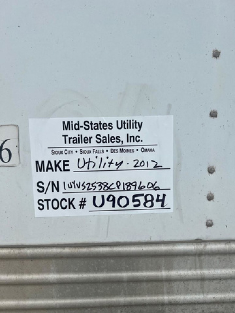 Trailer Sales tag with make/model handwritten: Make Utility 2012, S/N L0U... Stock # U90584. Vin 1UYVS2538CP189606.