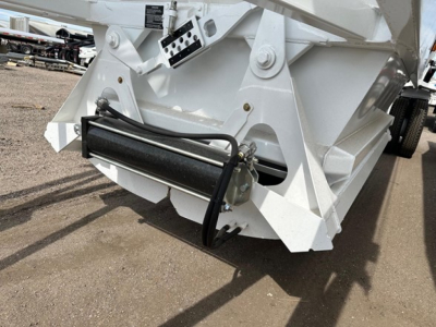 Ranco air ride bottom dump trailer rear view showing hydraulic cylinder and mounting hardware in white finish.