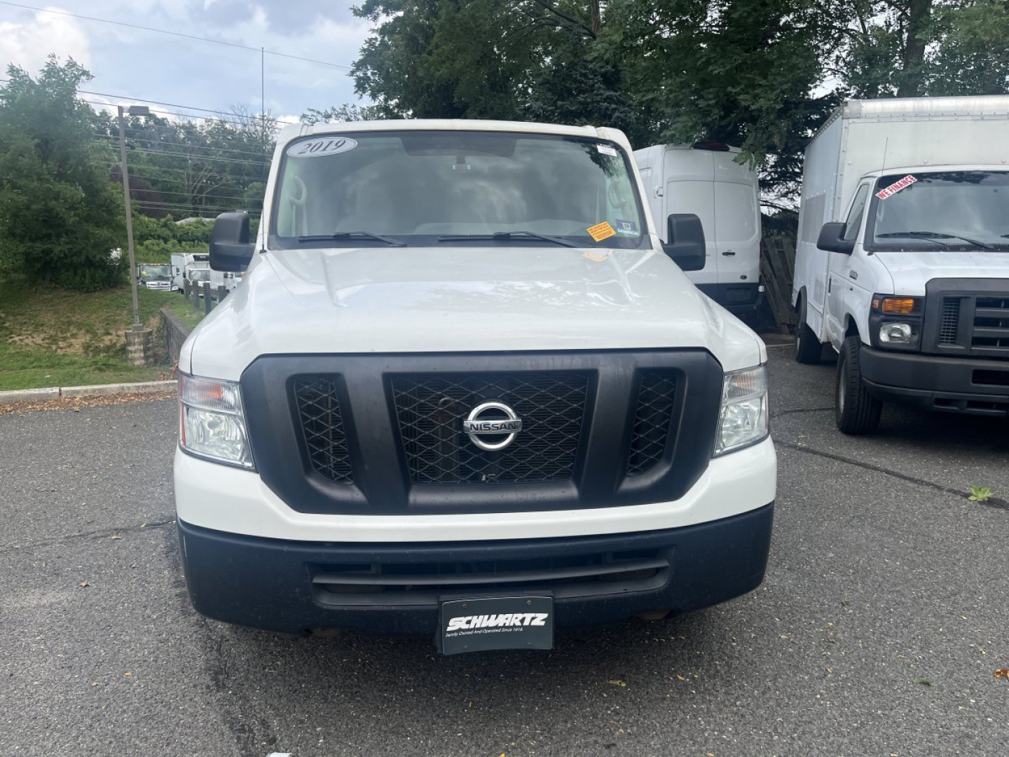 Nissan NV Cargo truck front view showing grille and bumper