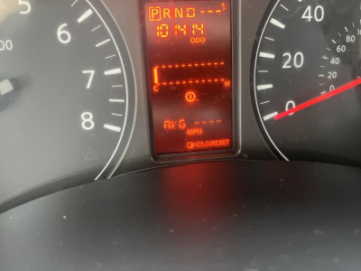 Dashboard of a 2019 Nissan NV Cargo showing gear indicator P R N D with odometer reading 1041 miles and digital display.